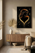 Framed artwork of a woman's silhouette in a heart shape on a wall in a living room.
