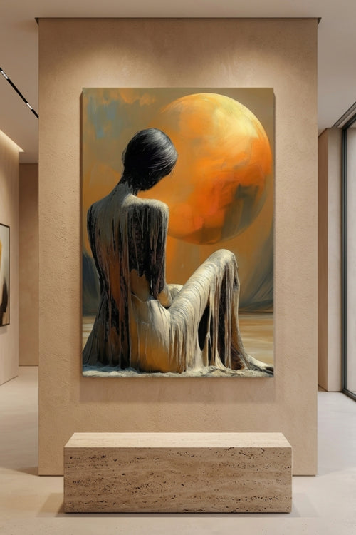 Artistic canvas art of a person sitting with a large orange celestial body in a modern interior setting.
